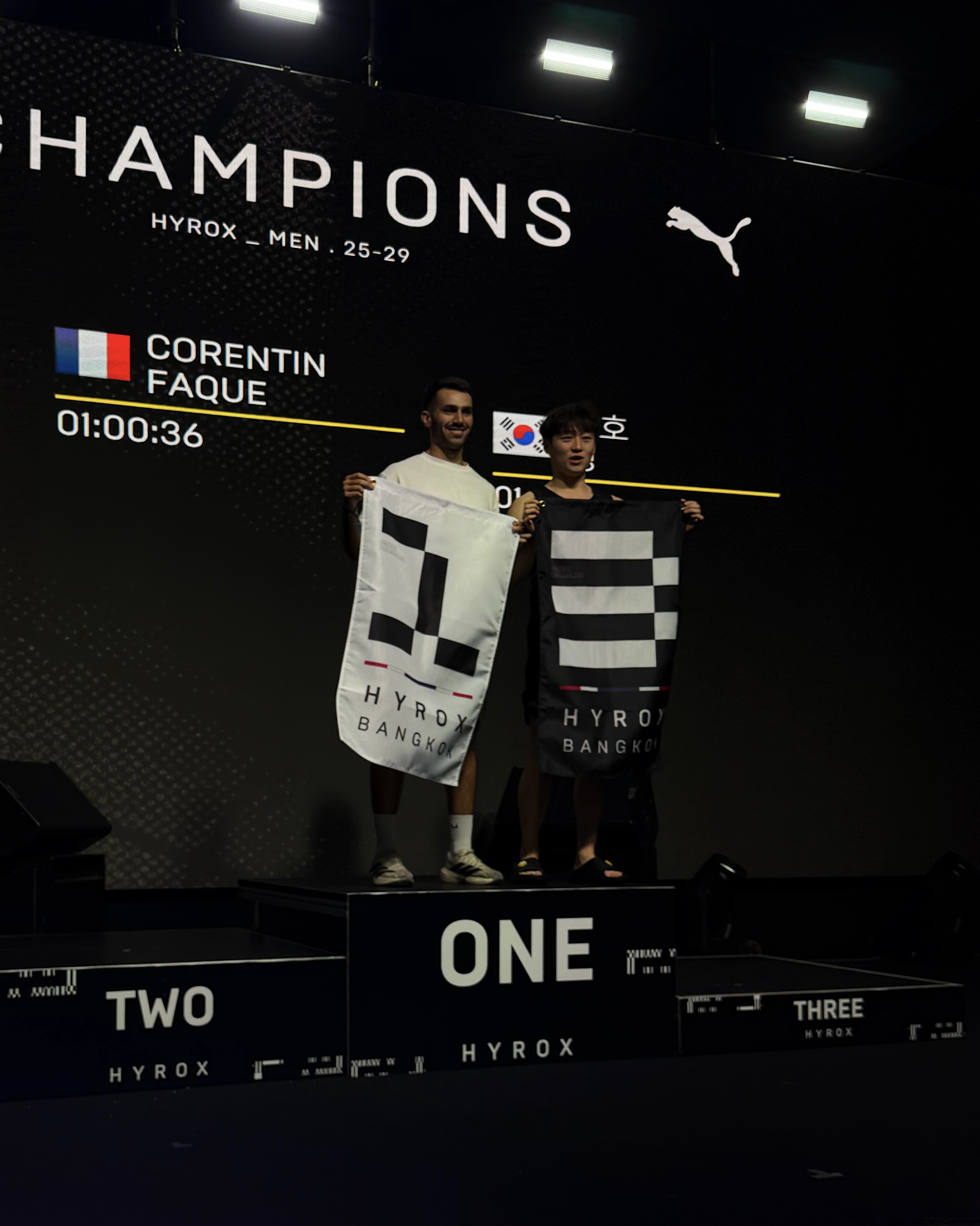 First place podium at HYROX Bangkok, men's 25-29 category, Corentin Faque, time 1 hour 0 minutes 36 seconds